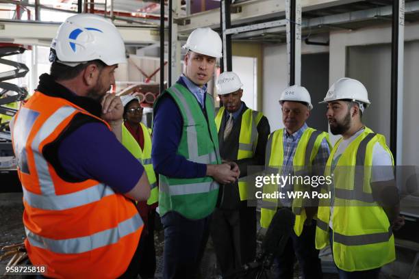 Prince William, Duke of Cambridge speaks to Jason Garcia , whose cousin Jessica perished in the fire, and presenter Nick Knowles as he joins the crew...