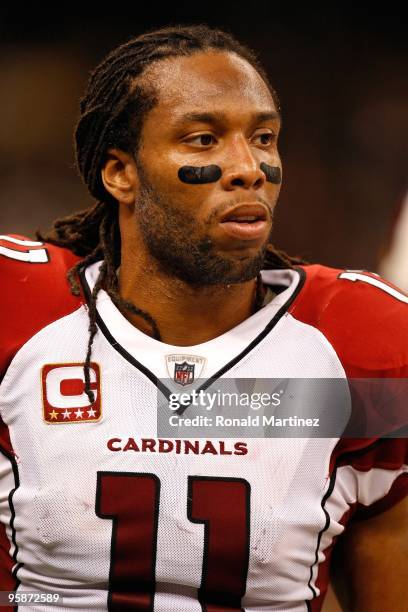 Larry Fitzgerald of the Arizona Cardinals looks on against the New Orleans Saints during the NFC Divisional Playoff Game at Louisana Superdome on...