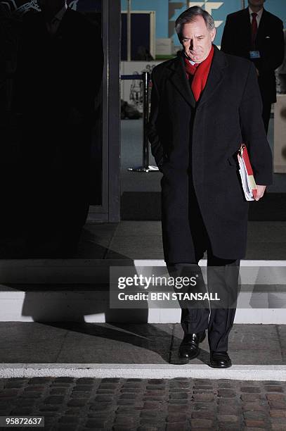 Former British Defence Minister Geoff Hoon leaves the QE2 centre in central London on January 19 as he prepares to provide evidence in the ongoing...