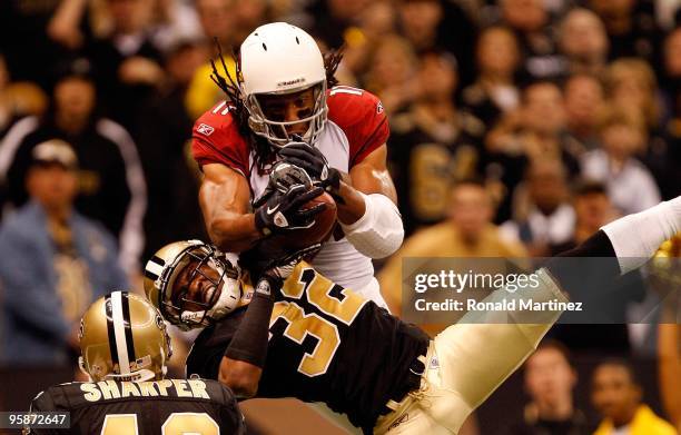 Larry Fitzgerald of the Arizona Cardinals fails to come a reception in the endzone against Jabari Greer of the New Orleans Saints during the NFC...