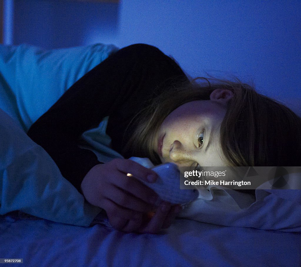 Girl laying in bed.