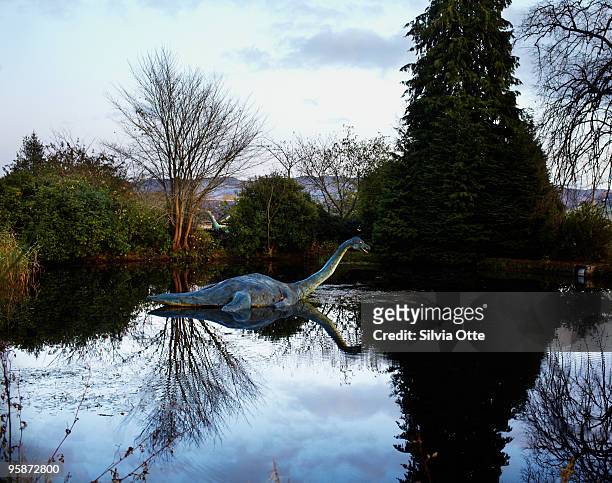 statue of nessie, the monster in drumnadrochit - silvia otte stock pictures, royalty-free photos & images