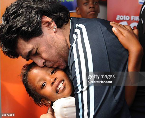In this handout photo provided by 2010 FIFA World Cup Organising Committee South Africa, Argentina national soccer team's head coach Diego Maradona...