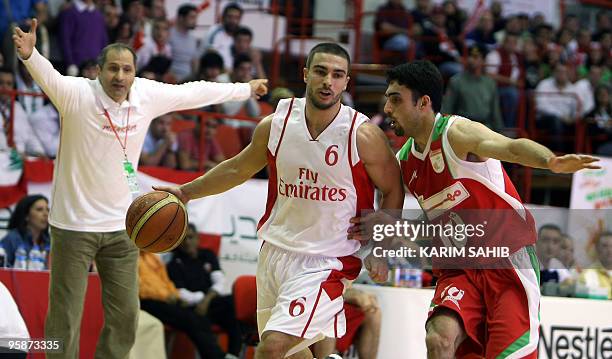 Ali Mahmud of Lebanon's Al-Riyadi club runs with the ball as Mame Afagh Eslameh of Iran's Mahram club tries to block him during the 21st Dubai...