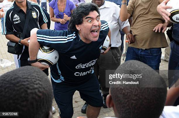 In this handout photo provided by 2010 FIFA World Cup Organising Committee South Africa, Argentina national soccer team's head coach Diego Maradona...