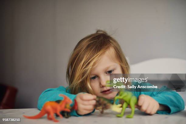 child playing with toys - dinosaur toy i stock pictures, royalty-free photos & images