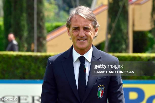 Italy's national football team newly appointed head coach, Roberto Mancini poses after a press conference on May 15, 2018 at the national team's...