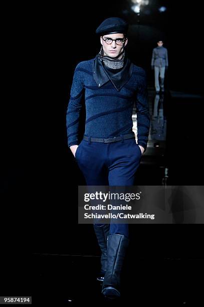 Model walks the runway during the Giorgio Armani Stampa Milan Menswear Autumn/Winter 2010 show on January 19, 2010 in Milan, Italy.