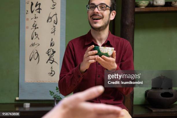 caucasian man enjoy tea ceremony - tea ceremony stock pictures, royalty-free photos & images