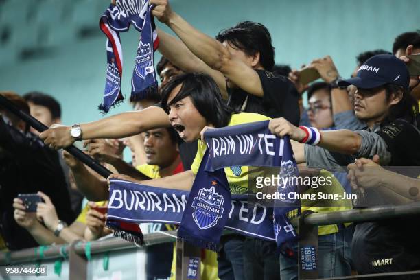 Buriram United fans show their support after their 0-2 defeat in the AFC Champions League Round of 16 second leg match between Jeonbuk Hyundai Motors...