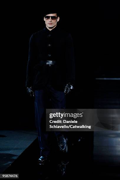 Model walks the runway during the Giorgio Armani Stampa Milan Menswear Autumn/Winter 2010 show on January 19, 2010 in Milan, Italy.