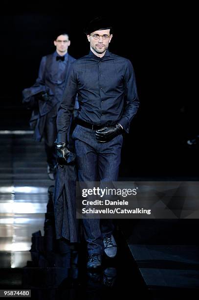 Model walks the runway during the Giorgio Armani Stampa Milan Menswear Autumn/Winter 2010 show on January 19, 2010 in Milan, Italy.