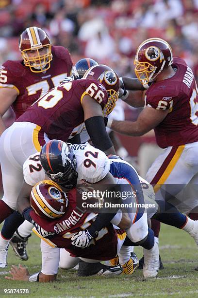 Defensive end Elvis Dumervil of the Denver Broncos sacks quarterback Jason Campbell of the Washington Redskins during a game on November 15, 2009 at...