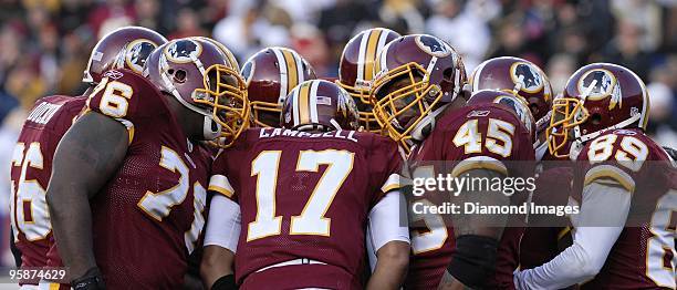 Quarterback Jason Campbell of the Washington Redskins calls out the next play in the in the huddle during a game against the New Orleans Saints on...