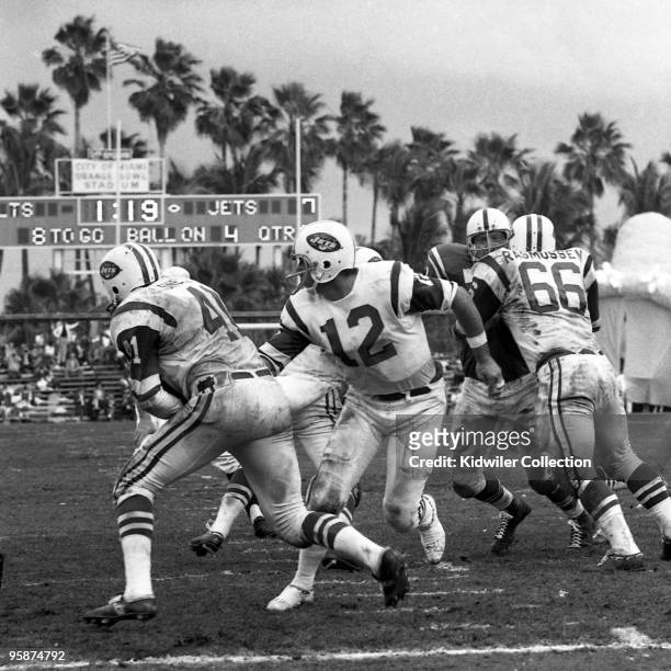 Quarterback Joe Namath of the New York Jets hands the ball to runningback Matt Snell during the second quarter of Super Bowl III against the...