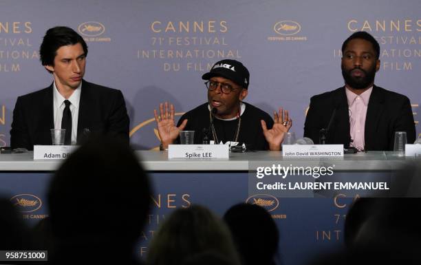 Director Spike Lee speaks on May 15, 2018 as US actor Adam Driver and US actor John David Washington listen during a press conference for the film...