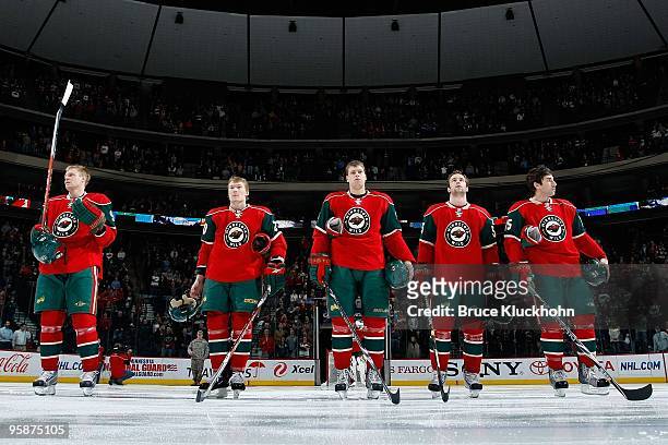 Mikko Koivu, Antti Miettinen, Kim Johnsson, Nick Schultz, and Andrew Brunette of the Minnesota Wild stand during the national anthem prior to the...