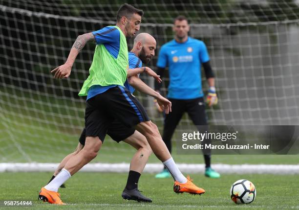 Borja Valero is challenged by Matias Vecino during the FC Internazionale training session at the club's training ground Suning Training Center in...