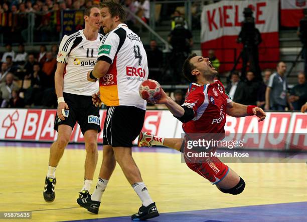 Bartosz Jurecki of Poland throws at goal during the Men's Handball European Championship Group C match between Germany and Poland at the Olympia Hall...