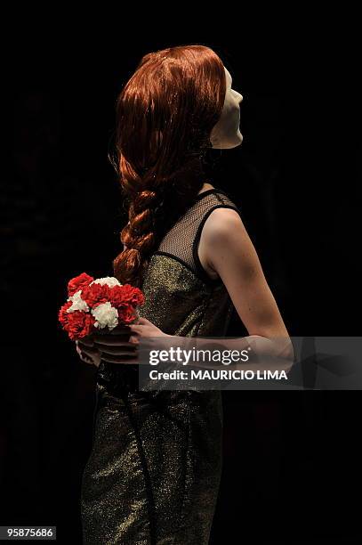 Model presents a creation by designer Ronaldo Fraga as part of the 2010-2011 Fall-Winter collections of the Sao Paulo Fashion Week, in Sao Paulo,...