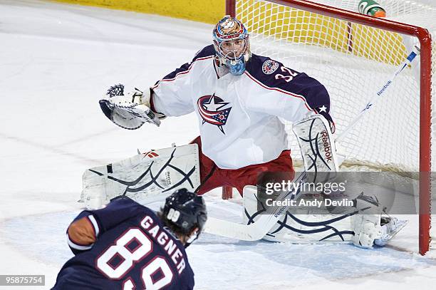 Mathieu Garon of the Columbus Blue Jackets protects the net from a shot from Sam Gagner of the Edmonton Oilers at Rexall Place on January 7, 2010 in...