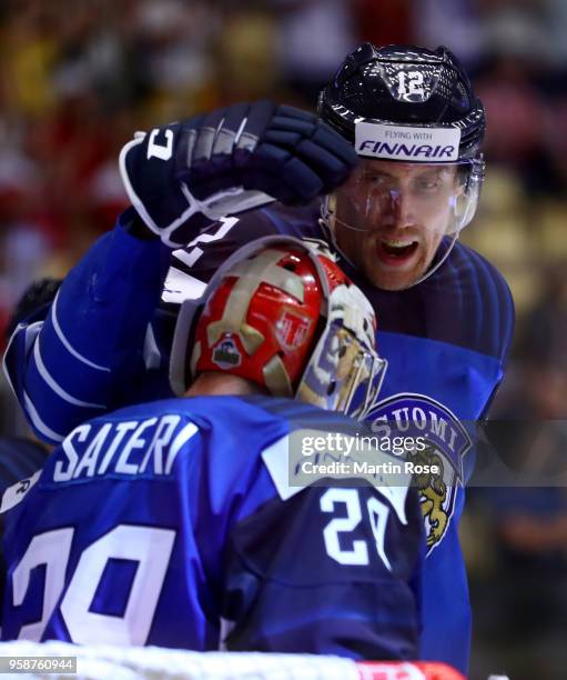 Marko Antilla of Finland celebrate with team mate Harri Sateri after the 2018 IIHF Ice Hockey World Championship Group B game between Finland and...