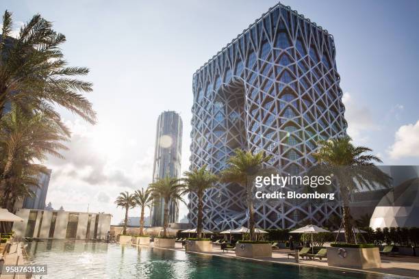 The Morpheus hotel, developed by Melco Resorts & Entertainment Ltd., stands during a media tour in Macau, China, on Tuesday, May 15, 2018. Melco is...