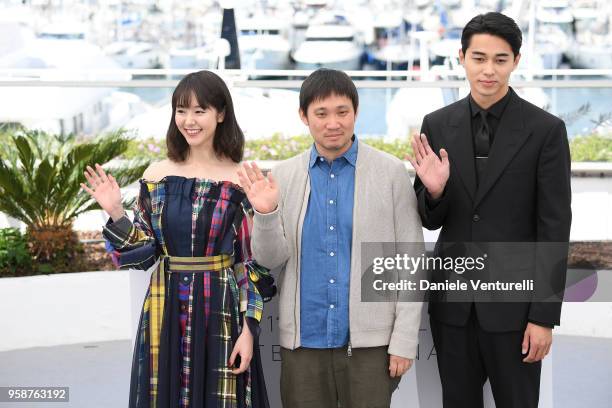 Masahiro Higashide , director Ryusuke Hamaguchi and Erika Karata attends the photocall for the "Asako I & II " during the 71st annual Cannes Film...