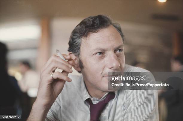 American novelist, biographer and journalist Clifford Irving pictured smoking a cigarette in Madrid, Spain on 31st January 1972. Clifford Irving and...