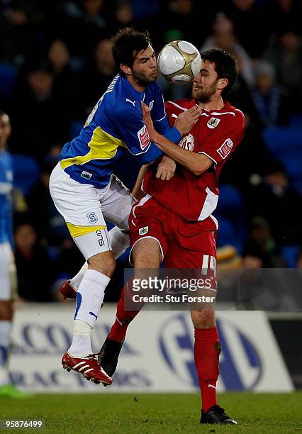 Cardiff player Joe Ledley challenges Bristol City player Cole Skuse during the FA Cup sponsored by E.ON 3rd Round Replay match between Cardiff City...