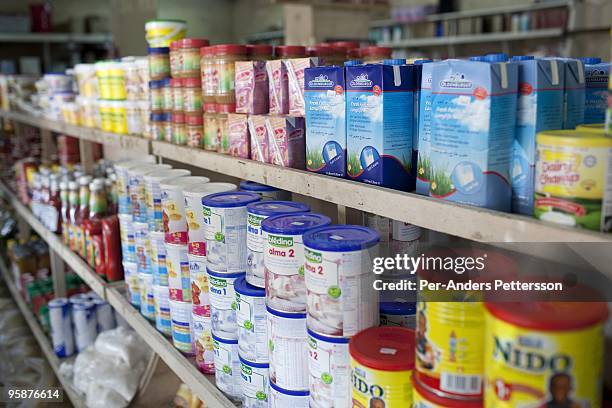 Imported milk powder from Europe companies are displayed in a super market on August 6, 2009 in Bamenda, Cameroon. Many small farmers in the area are...