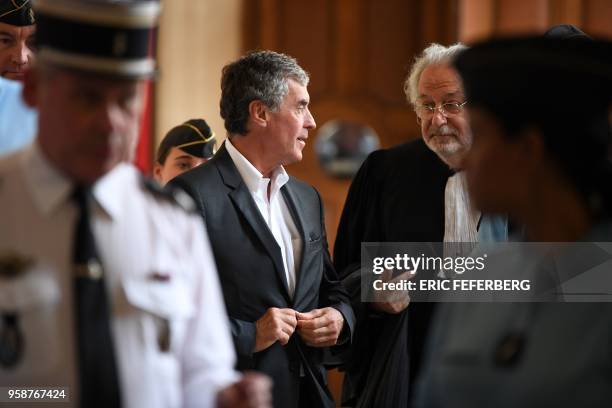 Former French budget minister Jerome Cahuzac , who was handed a three-year jail term in 2016 for tax evasion, speaks with one of his lawyers...