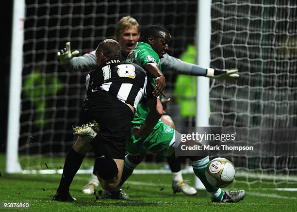 Stephen Hunt of Notts County tangles with Isiah Rankin of Forest Green Rovers during the FA Cup sponsored by E.O.N 3rd Round match between Notts...