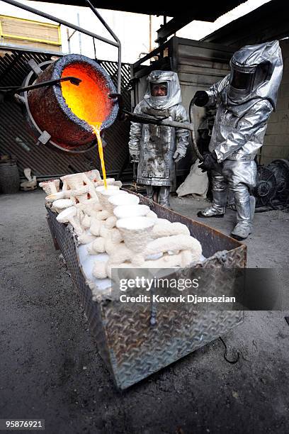 Molten bronze is poured into casts for "The Actor" statuette at the American Fine Arts Foundry on January 19, 2010 in Burbank, California. The...