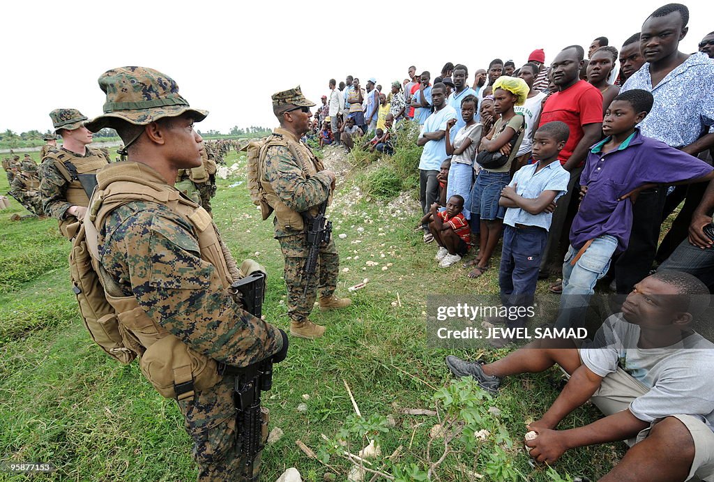 Haitian earthquake survivor watch as US