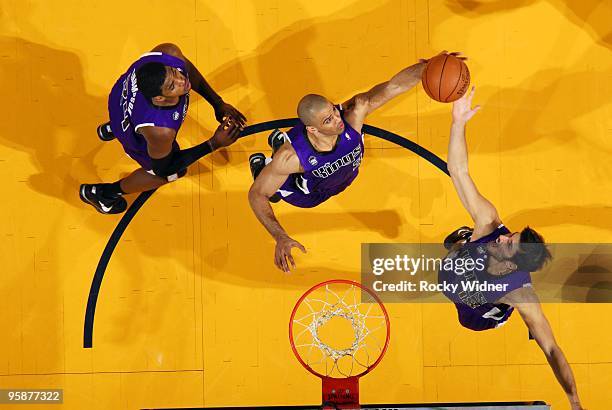 Ime Udoka and Omri Casspi of the Sacramento Kings rebound during the game against the Golden State Warriors at Oracle Arena on January 8, 2010 in...