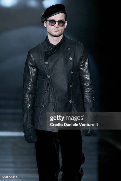 Model walks the runway during the Giorgio Armani Milan Menswear Autumn/Winter 2010 show on January 19, 2010 in Milan, Italy.