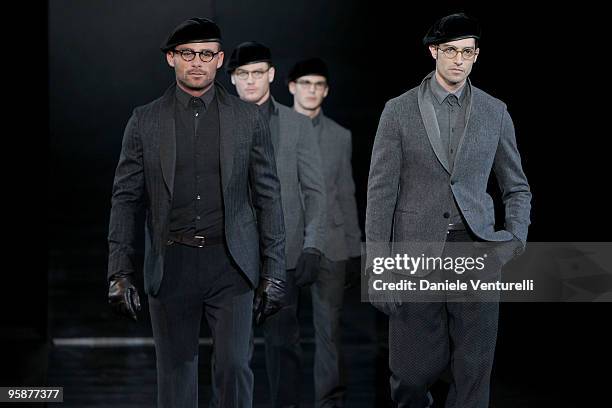 Models walk the runway during the Giorgio Armani Milan Menswear Autumn/Winter 2010 show on January 19, 2010 in Milan, Italy.