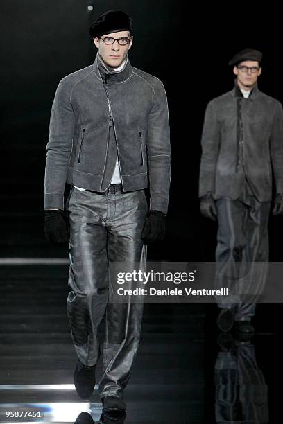 Models walk the runway during the Giorgio Armani Milan Menswear Autumn/Winter 2010 show on January 19, 2010 in Milan, Italy.