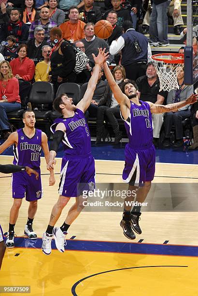 Andres Nocioni and Omri Casspi of the Sacramento Kings rebound during the game against the Golden State Warriors at Oracle Arena on January 8, 2010...