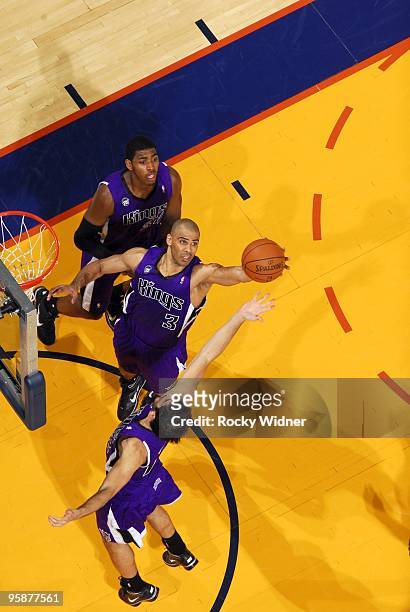 Ime Udoka and Omri Casspi of the Sacramento Kings rebound during the game against the Golden State Warriors at Oracle Arena on January 8, 2010 in...
