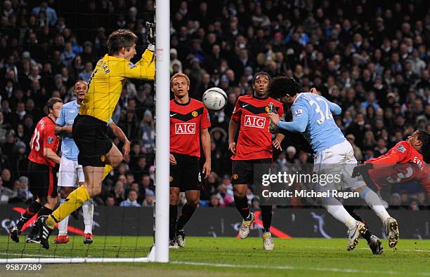 Carlos Tevez of Manchester City scores his team's second goal past Edwin Van der Sar of Manchester United during the Carling Cup Semi Final match...