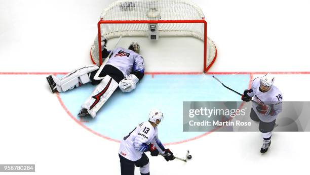 Keith Kinkaid, goaltender of the United States, Johnny Gaudreau and Nick Jensen react during the 2018 IIHF Ice Hockey World Championship Group B game...