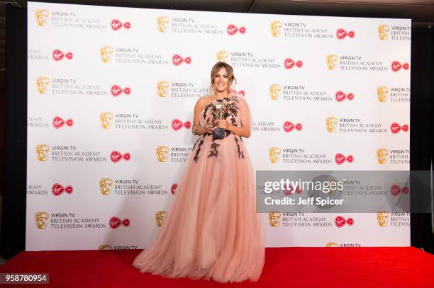 Caroline Flack poses with the award for Best Reality and Constructed Factual Series for 'Love Island' in the press room at the Virgin TV British...