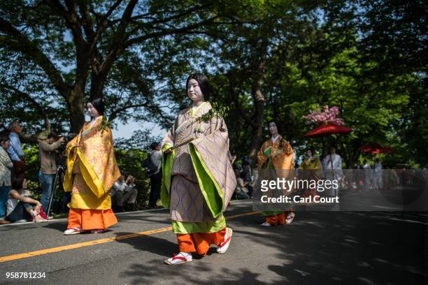 People in Heian period dress take part in the the Aoi Festival on May 15, 2018 in Kyoto, Japan. Aoi Festival is one of the three main festivals of...