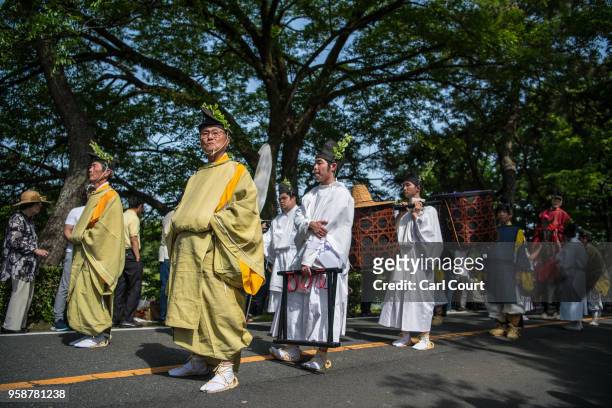 People in Heian period dress take part in the the Aoi Festival on May 15, 2018 in Kyoto, Japan. Aoi Festival is one of the three main festivals of...