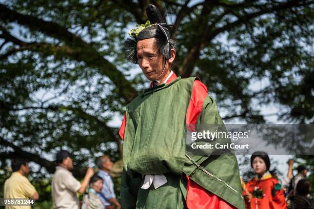 Man in Heian period dress takes part in the the Aoi Festival on May 15, 2018 in Kyoto, Japan. Aoi Festival is one of the three main festivals of...