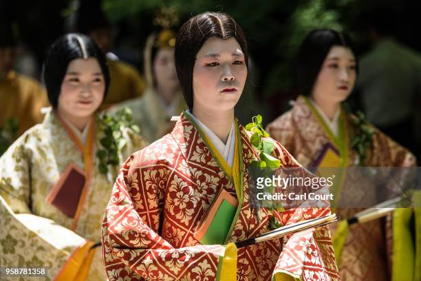 Women in Heian period dress take part in the the Aoi Festival on May 15, 2018 in Kyoto, Japan. Aoi Festival is one of the three main festivals of...