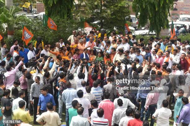 Workers are seen celebrating party's victory in Karnataka elections at state BJP headquarters on May 15, 2018 in Bhopal, India. Out of 222 seats...