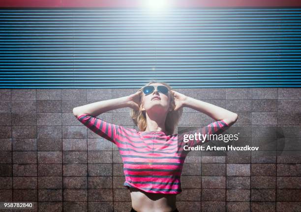 Concept of cool eyeglasses . Joyful girl with black sunglasses